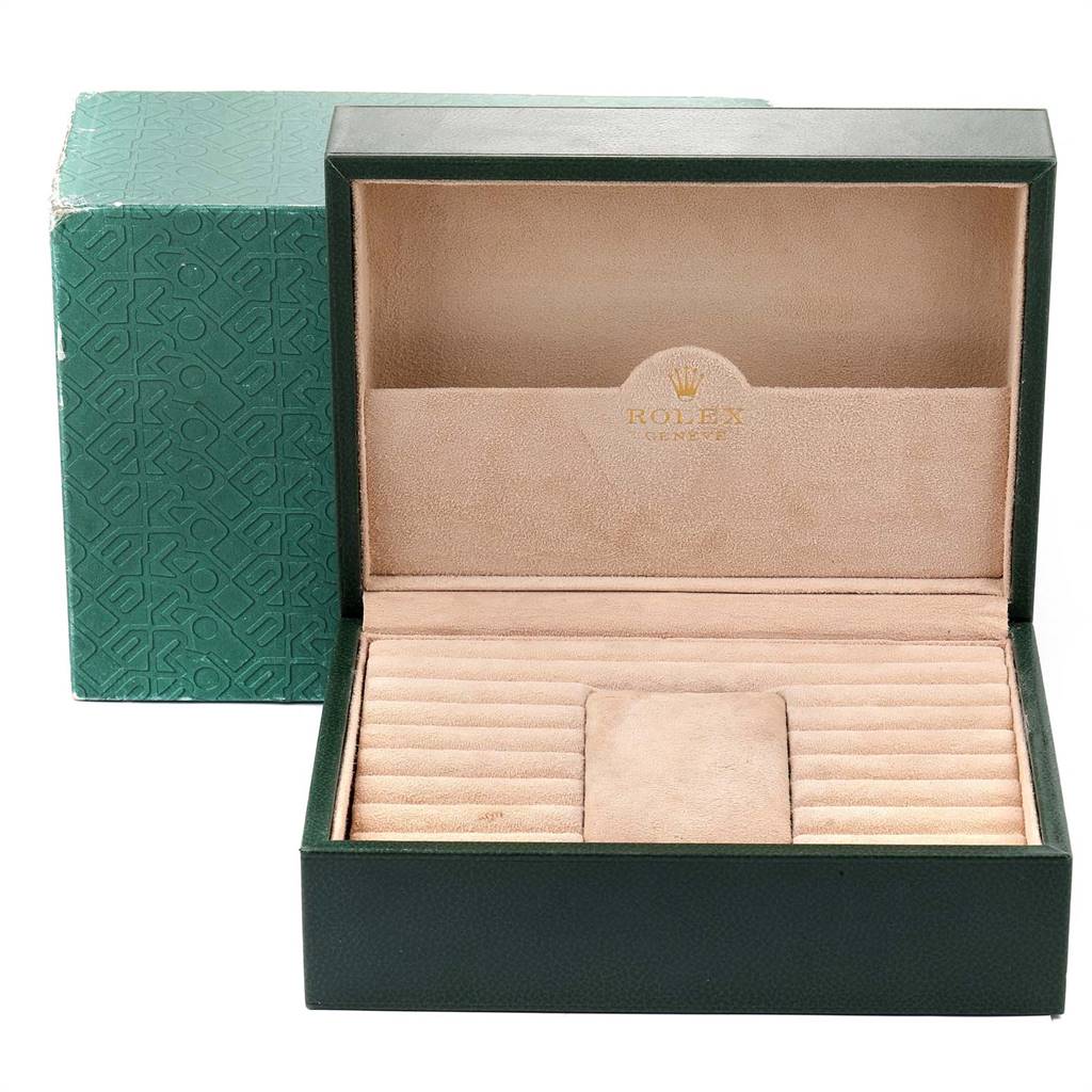 The image shows an open Rolex display box, likely for the President model, revealing the interior compartments for watch storage.