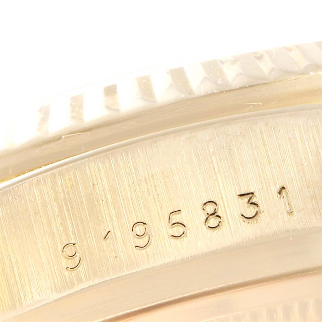 This close-up image shows the etched serial numbers on the casing of a Rolex President 18038 Men
s Yellow Gold Silver Dial 18038 Men
s Yellow Gold Silver Dial model watch.