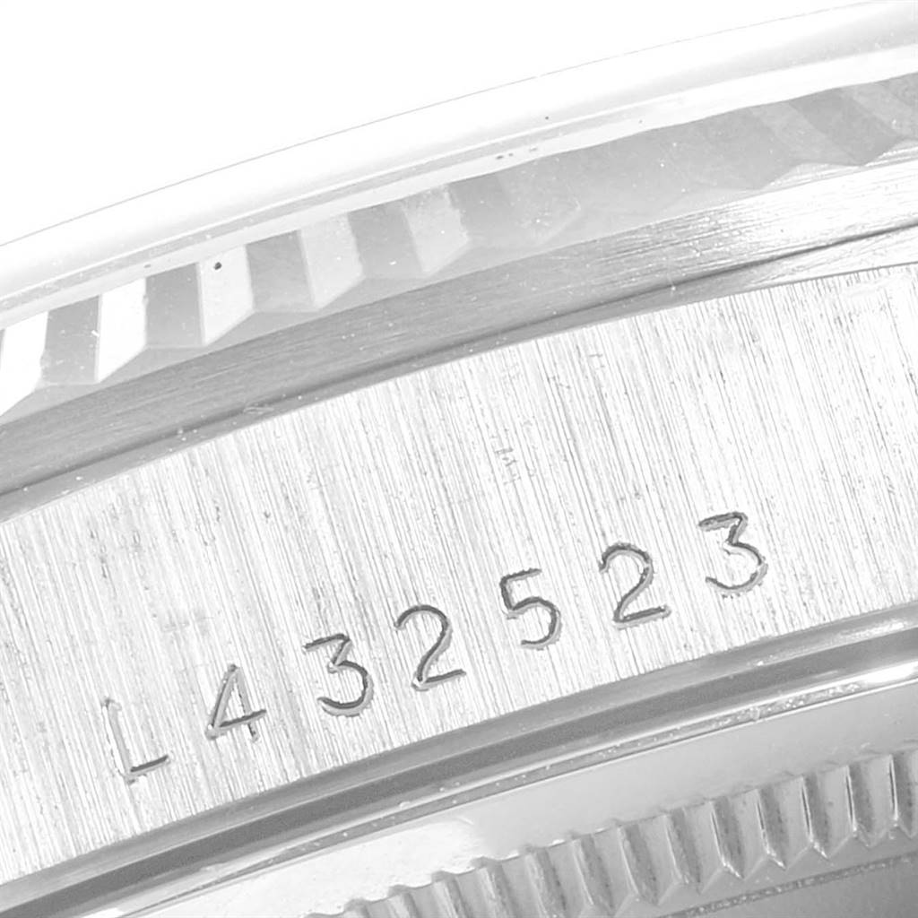 This image shows a close-up of the bezel and engraved serial number on a Rolex President 18239 Men's White Gold Silver Dial 18239 Men's White Gold Silver Dial model watch.