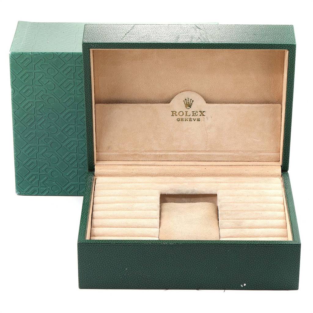 This image shows an open luxury green Rolex President 18239 Men's White Gold Silver Dial 18239 Men's White Gold Silver Dial watch box with beige interior and compartments for the watch and accessories.