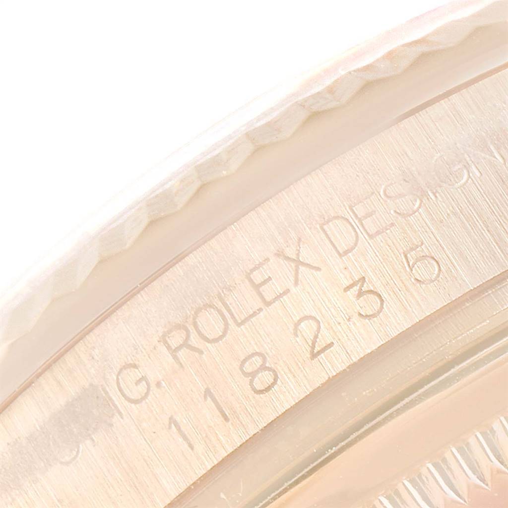 This image shows a close-up of the engraved side of a Rolex President 118235 Men's Rose Gold Champagne Dial 118235 Men's Rose Gold Champagne Dial model watch.