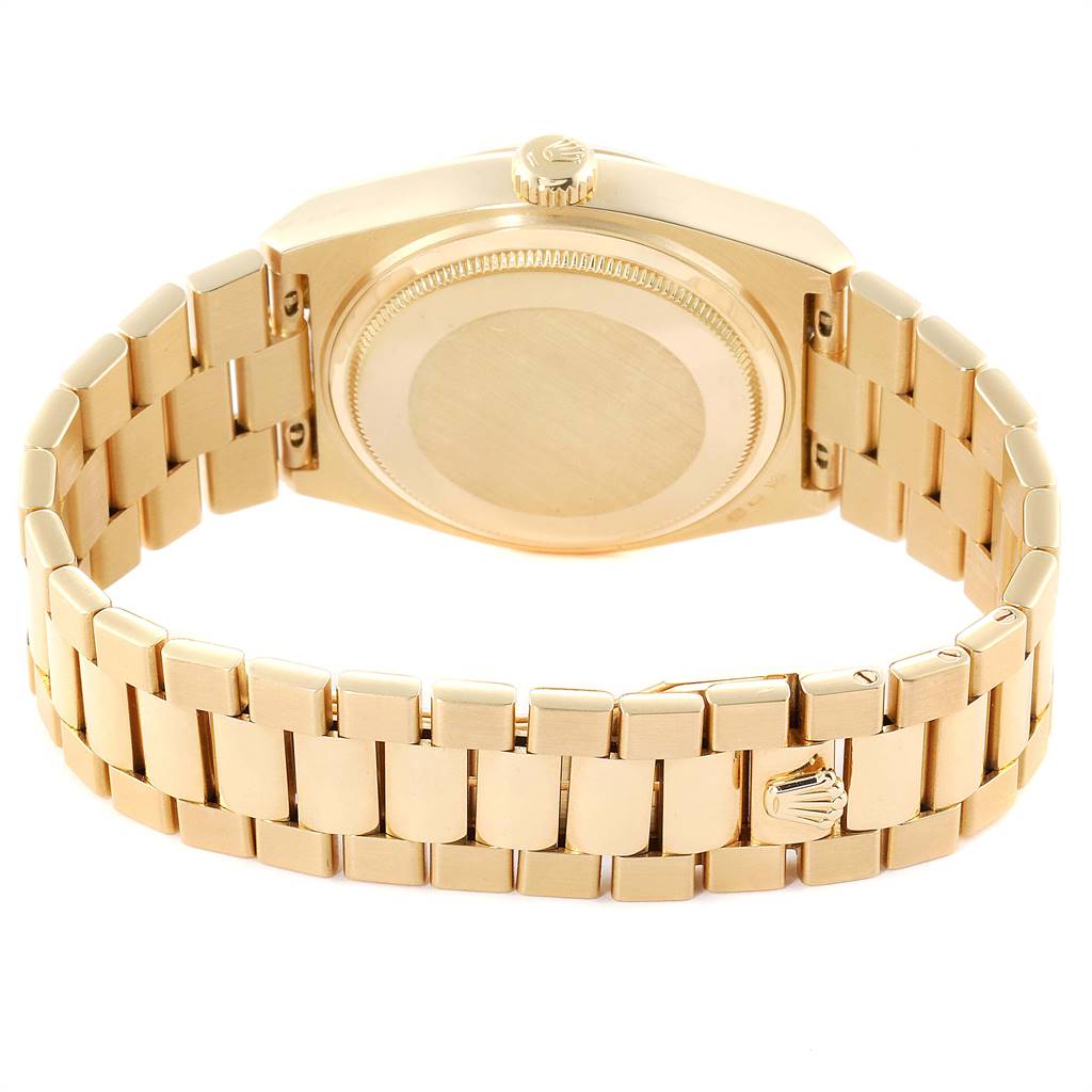 The image shows the back case, crown, and bracelet of the Rolex President 19018 Men
s Yellow Gold Black Dial 19018 Men
s Yellow Gold Black Dial model watch from a rear angle.