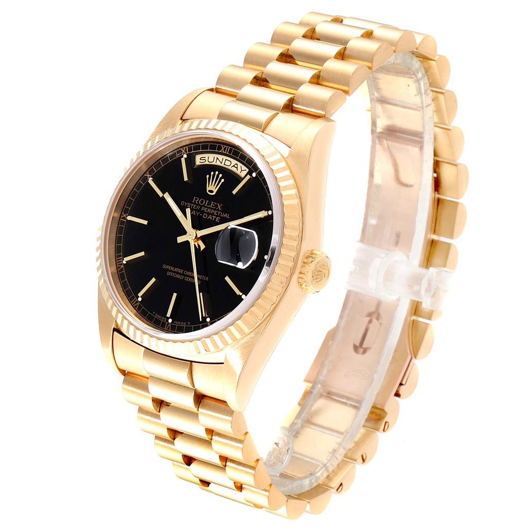 This image shows a side angle of the Rolex President 18238 Men
s Yellow Gold Black Dial 18238 Men
s Yellow Gold Black Dial model watch, highlighting its gold bracelet, black dial, and fluted bezel.