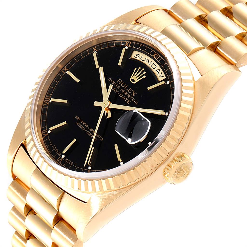 The image shows a close-up of a Rolex President 18238 Men
s Yellow Gold Black Dial 18238 Men
s Yellow Gold Black Dial model watch, highlighting the dial, crown, bracelet, and bezel at a slight angle.