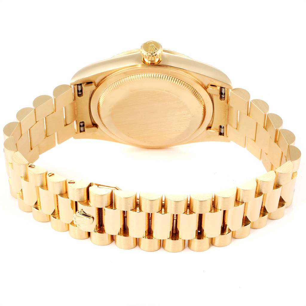 The image shows the back view of the Rolex President 18238 Men
s Yellow Gold Black Dial 18238 Men
s Yellow Gold Black Dial model watch, focusing on the case back and the bracelet.