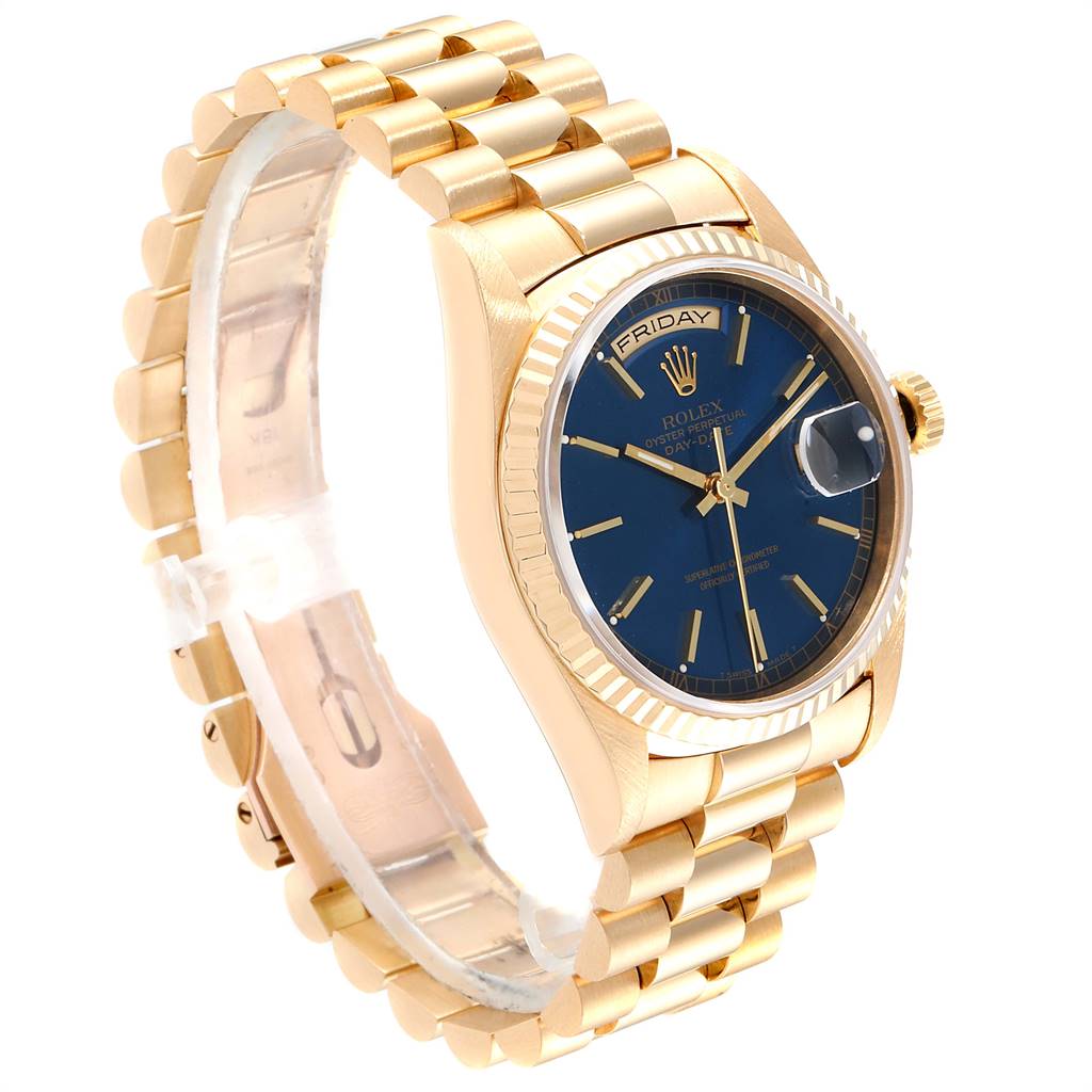 This image shows a Rolex President 18238 Men
s Yellow Gold Blue Dial 18238 Men
s Yellow Gold Blue Dial model watch in a side angle, highlighting its gold bracelet, blue dial, and fluted bezel.