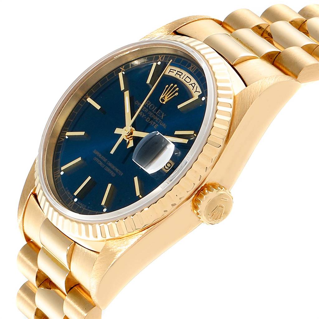 This image shows a side angle of a Rolex President 18238 Men
s Yellow Gold Blue Dial 18238 Men
s Yellow Gold Blue Dial model watch, highlighting its blue dial, gold case, and bracelet.