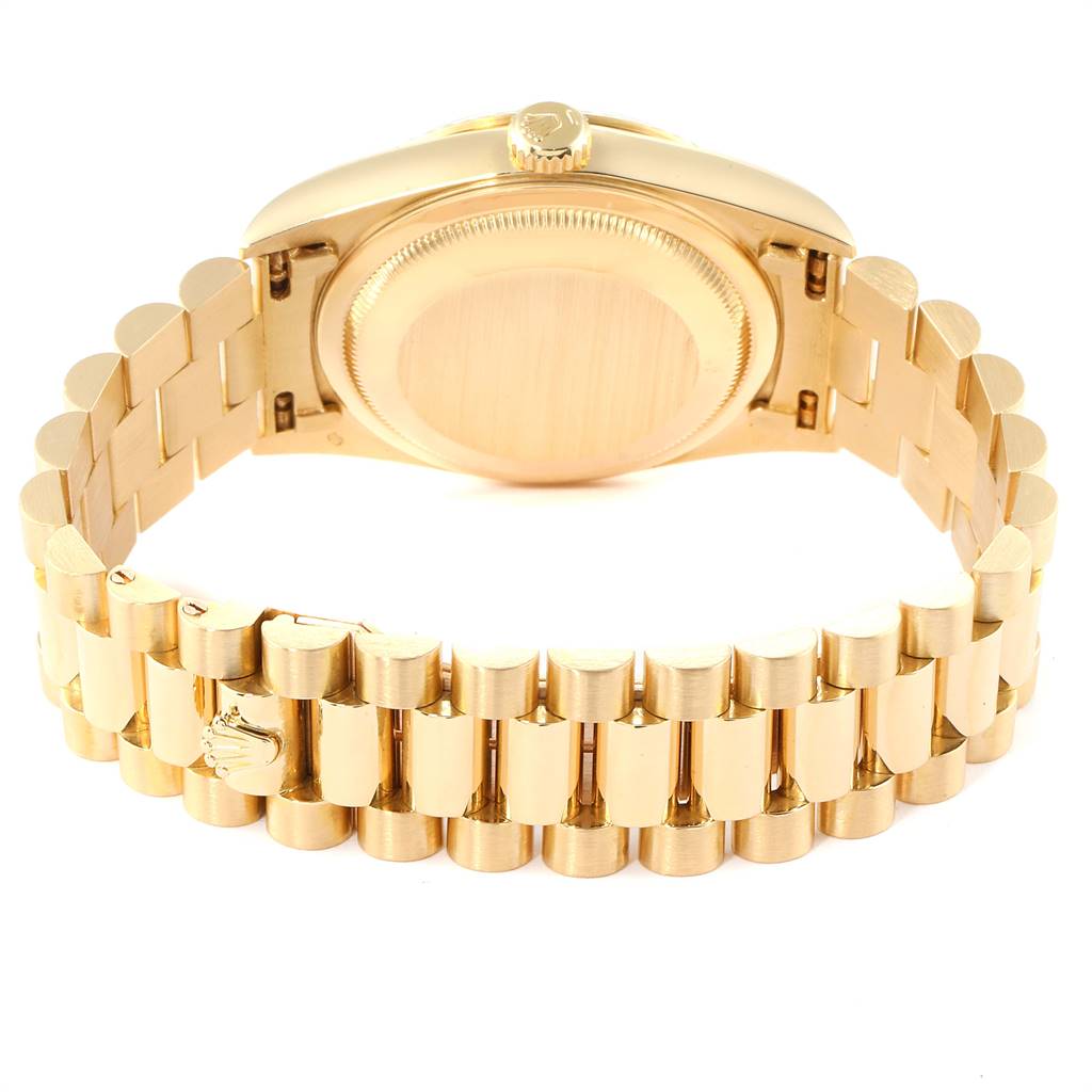 This image shows the back case and gold bracelet of a Rolex President 18238 Men
s Yellow Gold Blue Dial 18238 Men
s Yellow Gold Blue Dial model watch from a rear angle.