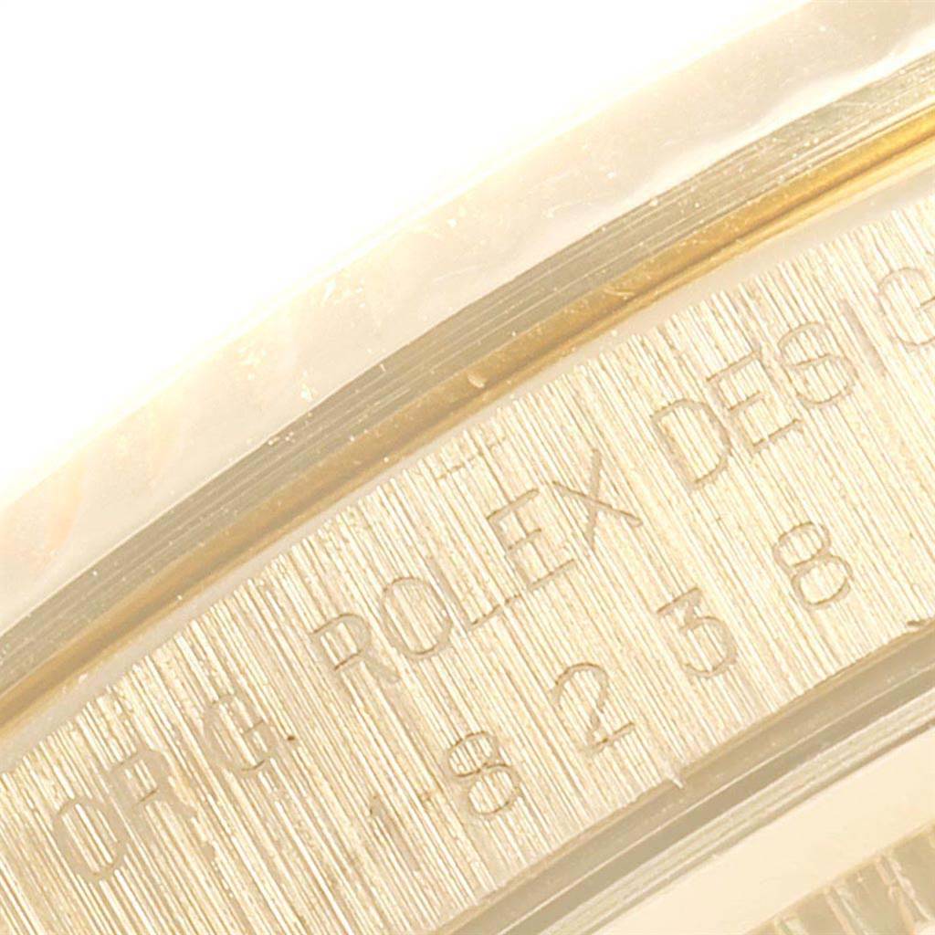 This close-up image shows the engraved inner bezel of the Rolex President 18238 Men
s Yellow Gold Blue Dial 18238 Men
s Yellow Gold Blue Dial model watch.