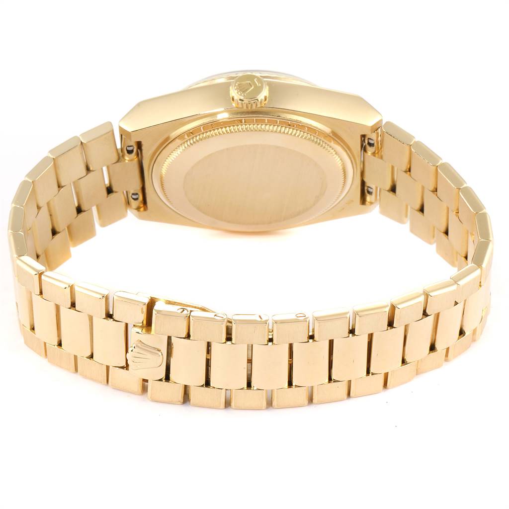 This image shows the Rolex President 19018 Men
s Yellow Gold Black Dial 19018 Men
s Yellow Gold Black Dial model watch from a rear angle, highlighting the case back, crown, and bracelet with clasp.