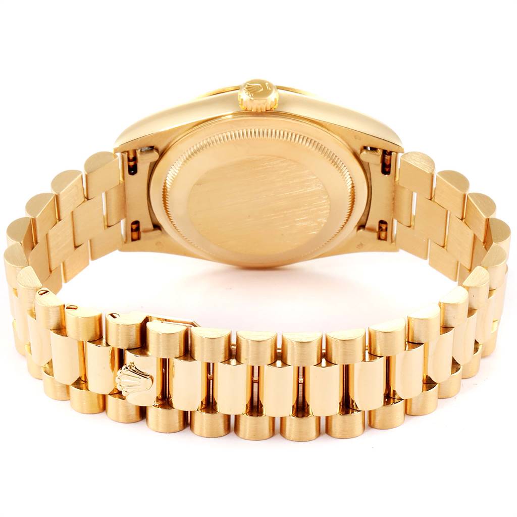 The image shows the back view of a Rolex President 18238 Men
s Yellow Gold Beige Dial 18238 Men
s Yellow Gold Beige Dial model watch, highlighting its case back and bracelet.
