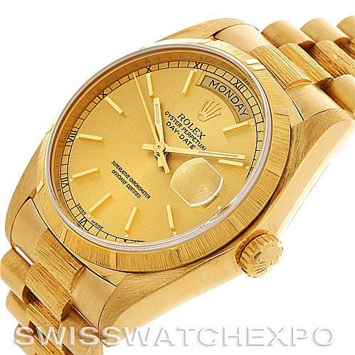 This image shows a Rolex President 18038 Men
s Yellow Gold Champagne Dial 18038 Men
s Yellow Gold Champagne Dial model watch, highlighting the dial, day-date display, crown, and bracelet from an angled top view.