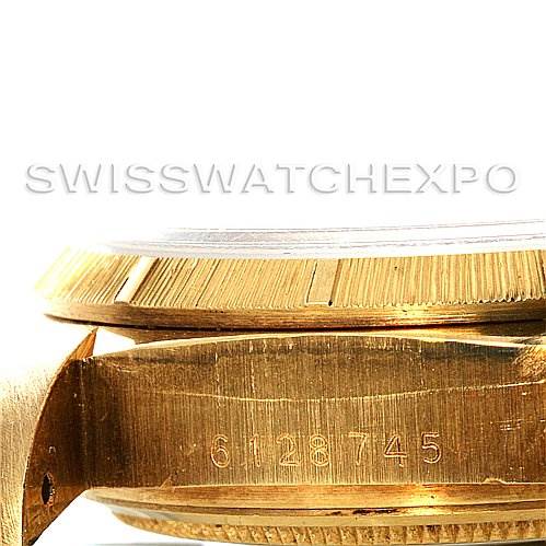 The image shows the side view of a Rolex President 18038 Men
s Yellow Gold Champagne Dial 18038 Men
s Yellow Gold Champagne Dial model watch, focusing on the serial number and part of the case and bezel.