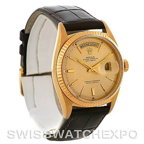 The image shows a Rolex President 1803 Men's Yellow Gold Champagne Dial 1803 Men's Yellow Gold Champagne Dial Day-Date watch at a three-quarter angle, highlighting its gold case, dial, day-date display, and leather strap.