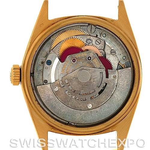 This is a close-up of the Rolex President 1803 Men's Yellow Gold Champagne Dial 1803 Men's Yellow Gold Champagne Dial model’s open case back showing its internal movement and parts.