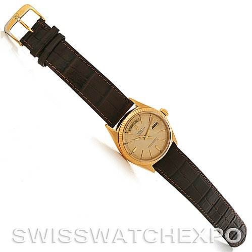 This image shows a Rolex President 1803 Men's Yellow Gold Champagne Dial 1803 Men's Yellow Gold Champagne Dial watch at an oblique angle, highlighting its gold case and brown leather strap.