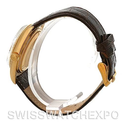 Side view of a Rolex President 1803 Men's Yellow Gold Champagne Dial 1803 Men's Yellow Gold Champagne Dial watch showing the case, crown, and leather strap.