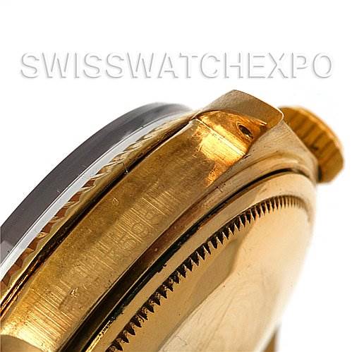 This image shows a close-up angle of the side of a Rolex President 1803 Men
s Yellow Gold Black Dial 1803 Men
s Yellow Gold Black Dial watch, highlighting the crown and part of the bezel.