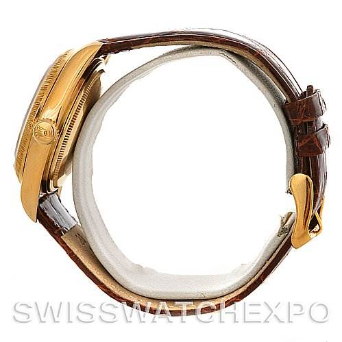 This image shows a side view of the Rolex President 16078 Men
s Yellow Gold Black Dial 16078 Men
s Yellow Gold Black Dial model, highlighting its case, crown, and leather strap.