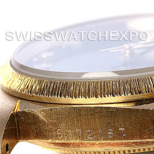 This image shows a close-up of the Rolex President 16078 Men
s Yellow Gold Black Dial 16078 Men
s Yellow Gold Black Dial model
s side profile, highlighting its bezel and part of the serial number on the case.