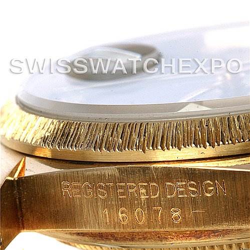 The image shows a close-up angle of the bezel and case edges of a Rolex President 16078 Men
s Yellow Gold Black Dial 16078 Men
s Yellow Gold Black Dial model watch, highlighting the fluted bezel and the "Registered Design" markings.