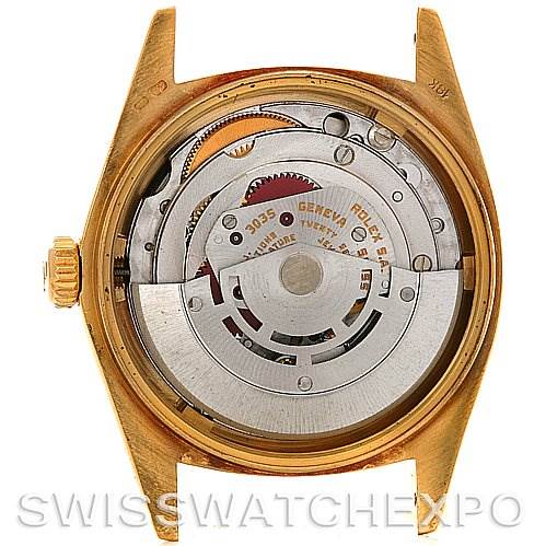 The image shows the inner mechanical movement of a Rolex President 16078 Men
s Yellow Gold Black Dial 16078 Men
s Yellow Gold Black Dial model watch, viewed from the back with the case opened.