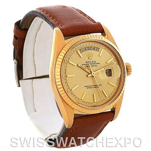 The image shows a Rolex President 1803 Men's Yellow Gold Champagne Dial 1803 Men's Yellow Gold Champagne Dial model, featuring its brown leather strap, gold case, day-date display, dial, and crown.