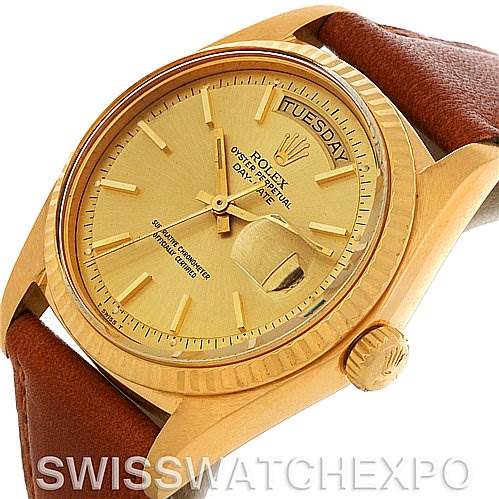 This image shows a Rolex President 1803 Men's Yellow Gold Champagne Dial 1803 Men's Yellow Gold Champagne Dial model watch, highlighting its gold face, day-date display, and brown leather strap from an angled side view.