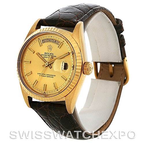 This image shows a Rolex President 1803 Men's Yellow Gold Champagne Dial 1803 Men's Yellow Gold Champagne Dial model watch with a gold case, leather strap, and view of the dial, bezel, and crown from a slightly angled perspective.