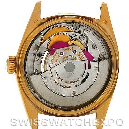 This is an internal view of a Rolex President 1803 Men's Yellow Gold Champagne Dial 1803 Men's Yellow Gold Champagne Dial model watch displaying the movement and detailed mechanics.