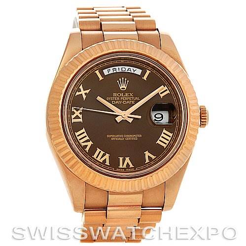 The image shows a front view of the Rolex President 218235RRP Men's Rose Gold Pink Dial 218235RRP Men's Rose Gold Pink Dial model watch, displaying its dial, day and date windows, and bracelet.