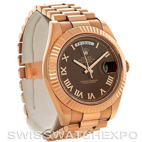 The image shows a Rolex President 218235RRP Men's Rose Gold Pink Dial 218235RRP Men's Rose Gold Pink Dial model watch at a slight angle, highlighting its bracelet, bezel, and dial with Roman numerals.