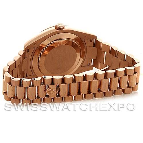 The image shows the back case and bracelet of a Rolex President 218235RRP Men's Rose Gold Pink Dial 218235RRP Men's Rose Gold Pink Dial model watch at an angled view.