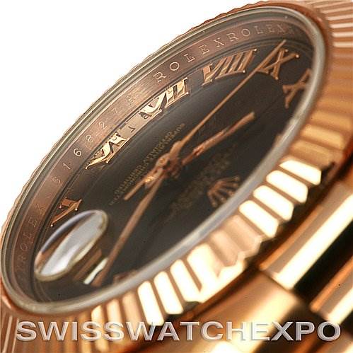The image shows a close-up side angle of the Rolex President 218235RRP Men's Rose Gold Pink Dial 218235RRP Men's Rose Gold Pink Dial model watch, highlighting its fluted bezel and Roman numeral dial.