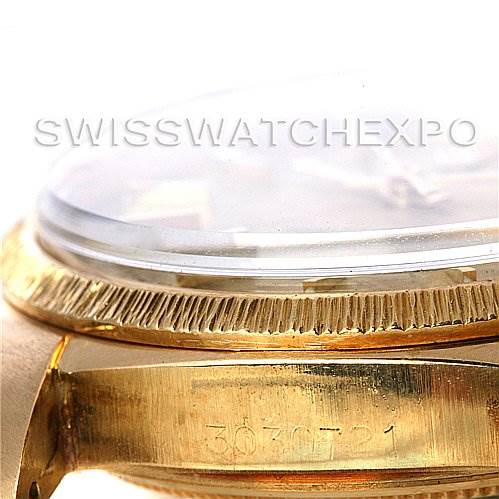 The image shows a side angle of the Rolex President 1807 Men's Yellow Gold Champagne Dial 1807 Men's Yellow Gold Champagne Dial watch, highlighting the fluted bezel and part of the serial number on the case.