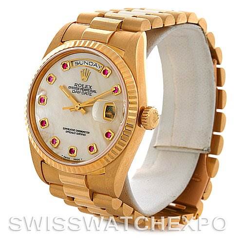 The image shows a side angle of a Rolex President 18238 Men's Yellow Gold Mother of Pearl Dial 18238 Men's Yellow Gold Mother of Pearl Dial model watch, highlighting its gold case and bracelet, date window, and day display.