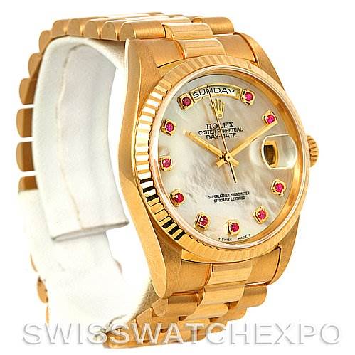 The image shows a front-left angled view of a Rolex President 18238 Men's Yellow Gold Mother of Pearl Dial 18238 Men's Yellow Gold Mother of Pearl Dial model watch, highlighting its gold casing, bracelet, and gemstone-encrusted dial.