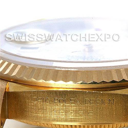 This image shows a close-up side angle of the Rolex President 18238 Men's Yellow Gold Mother of Pearl Dial 18238 Men's Yellow Gold Mother of Pearl Dial model watch, highlighting part of the bezel and case with engraving.