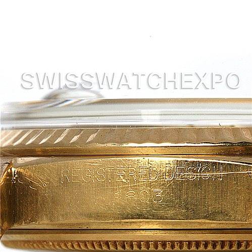 This image shows a close-up side view of a Rolex President 1803 Men's Yellow Gold Silver Dial 1803 Men's Yellow Gold Silver Dial model watch case, highlighting the bezel and part of the case back with engraved text.