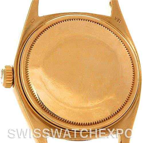 This image shows the back case and crown of a Rolex President 1803 Men's Yellow Gold Silver Dial 1803 Men's Yellow Gold Silver Dial model watch in gold.