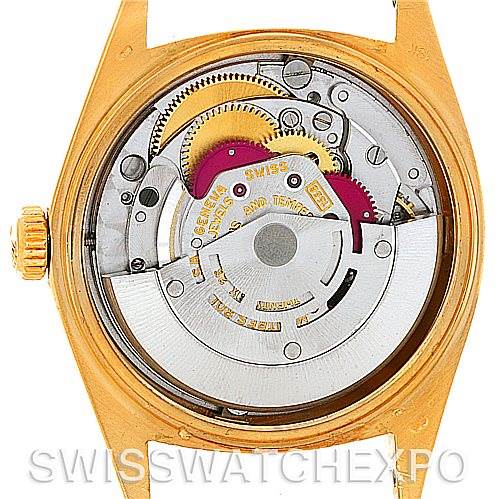 The image shows the movement mechanism of a Rolex President 1803 Men's Yellow Gold White Dial 1803 Men's Yellow Gold White Dial model watch from the back, highlighting its intricate gears and rotor.