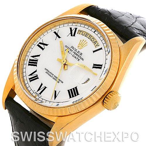 This image shows a close-up of the Rolex President 1803 Men's Yellow Gold White Dial 1803 Men's Yellow Gold White Dial model watch, displaying its dial, bezel, crown, and part of the leather strap.