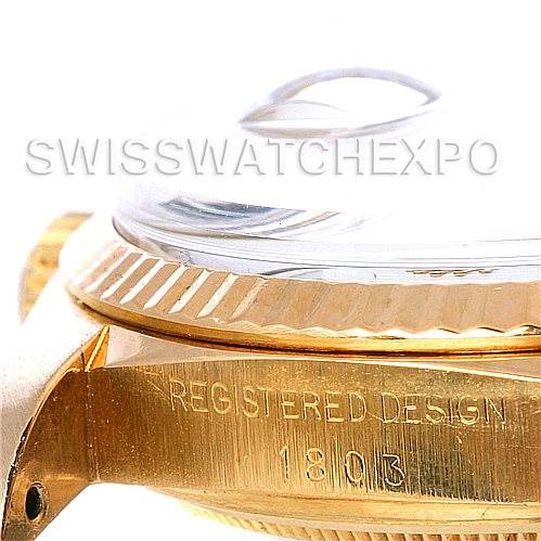 The image shows a side view of the Rolex President 1803 Men's Yellow Gold White Dial 1803 Men's Yellow Gold White Dial model's case, focusing on the bezel and engraving of "REGISTERED DESIGN 1803."