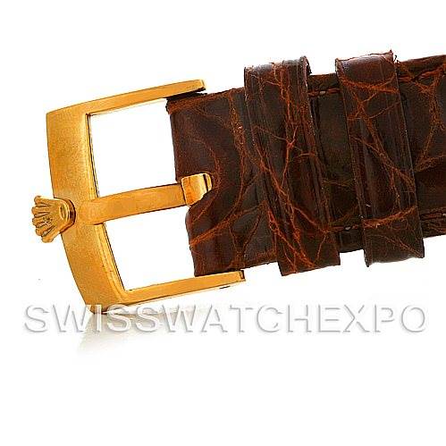 This image shows a close-up of a Rolex President 1803 Men's Yellow Gold Champagne Dial 1803 Men's Yellow Gold Champagne Dial model watch buckle and leather strap from a side angle.