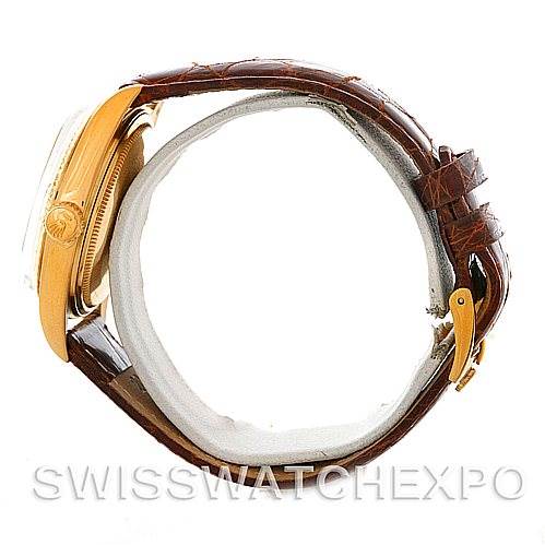 The image shows a side view of a Rolex President 1803 Men's Yellow Gold Champagne Dial 1803 Men's Yellow Gold Champagne Dial model watch featuring a brown leather strap and gold case.