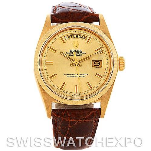 This image shows a front view of the Rolex President 1803 Men's Yellow Gold Champagne Dial 1803 Men's Yellow Gold Champagne Dial model watch, displaying its dial, hands, day window, date window, and leather strap.