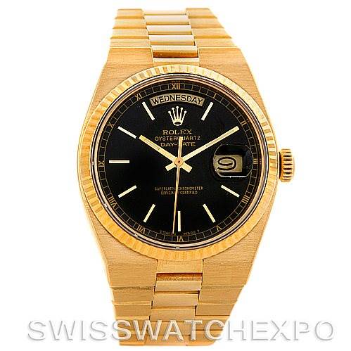 The image shows a front view of a Rolex Oysterquartz 19018 Men's Yellow Gold Black Dial 19018 Men's Yellow Gold Black Dial Day-Date watch, highlighting its dial, bezel, bracelet, and day-date feature.