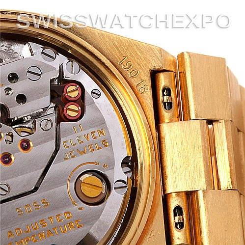 This close-up shows the movement and part of the bracelet of a Rolex Oysterquartz 19018 Men's Yellow Gold Black Dial 19018 Men's Yellow Gold Black Dial watch, highlighting "11 jewels" and "19018."