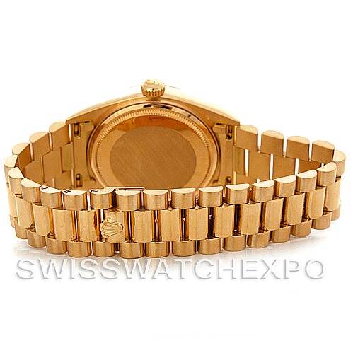 The image shows the back of a Rolex President 18038 Men's Yellow Gold Black Dial 18038 Men's Yellow Gold Black Dial model watch, highlighting the case back and the gold bracelet.