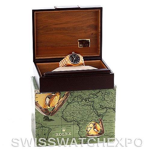 The image shows a Rolex President 18038 Men's Yellow Gold Black Dial 18038 Men's Yellow Gold Black Dial model watch placed inside an open wooden box.